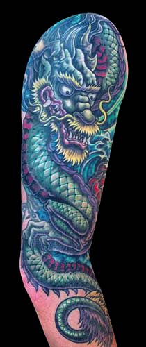 Cool Traditional Dragon Tattoo On Right Sleeve