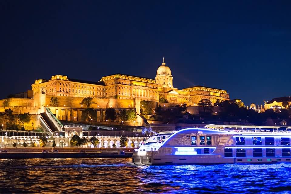 Cruise In Danube River Passing In Front Of The Buda Castle At Night