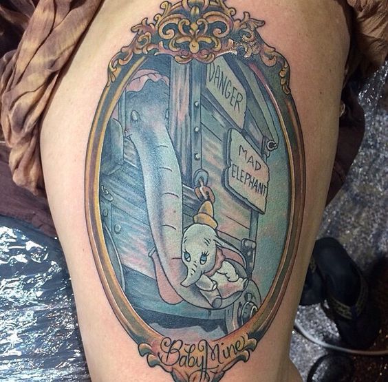 Dumbo With Mother In Frame Tattoo Design For Thigh