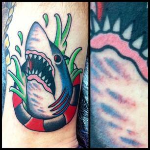 Evil Shark In Lifesaver Tube Tattoo Design For Forearm By Jay Thurley