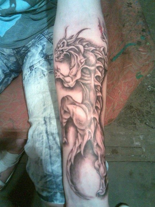 Fantastic Black And Grey Dragon Tattoo On Forearm