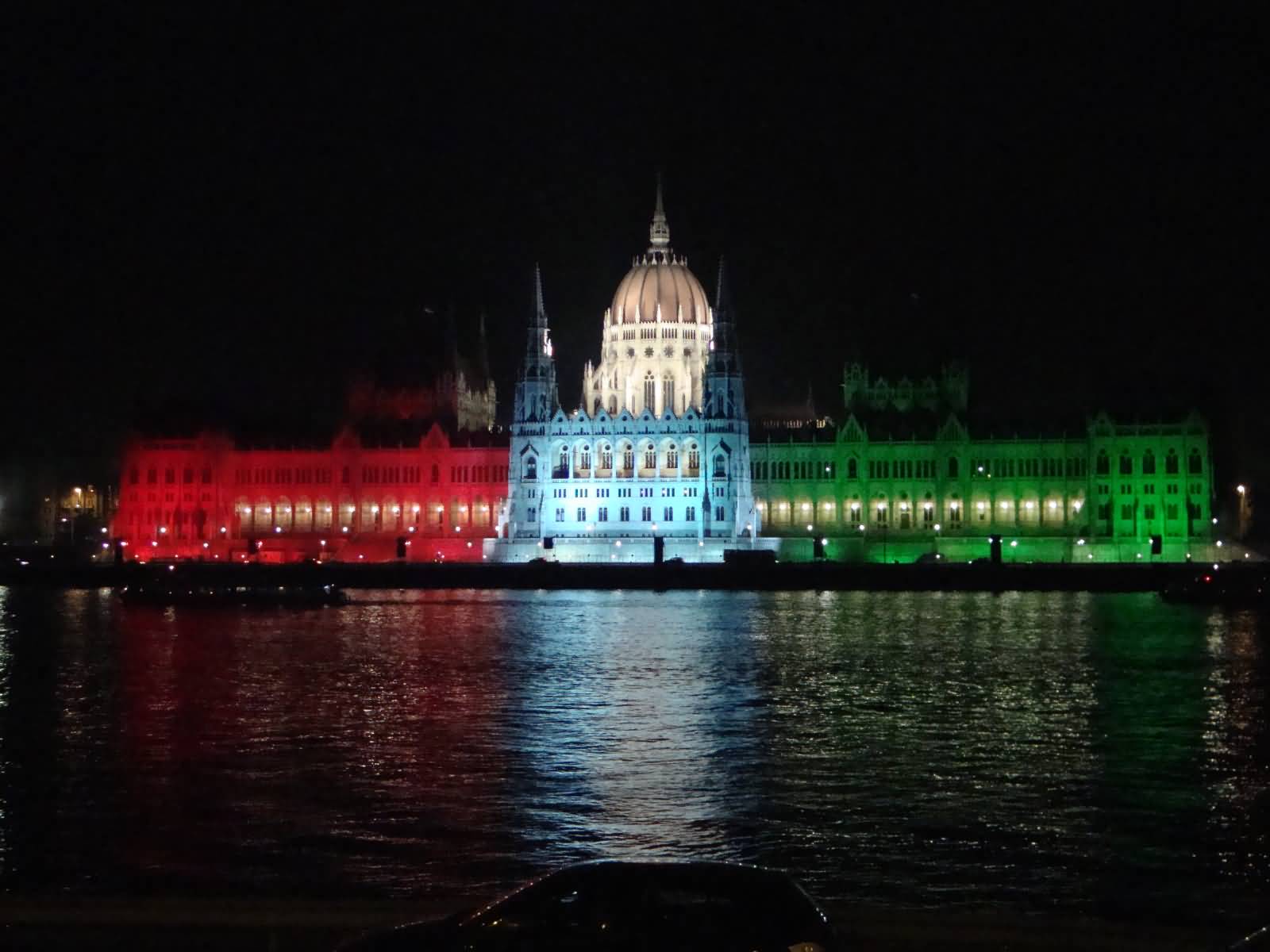Flag Of Hungary Lights On The Hungarian Parliament Building At Night