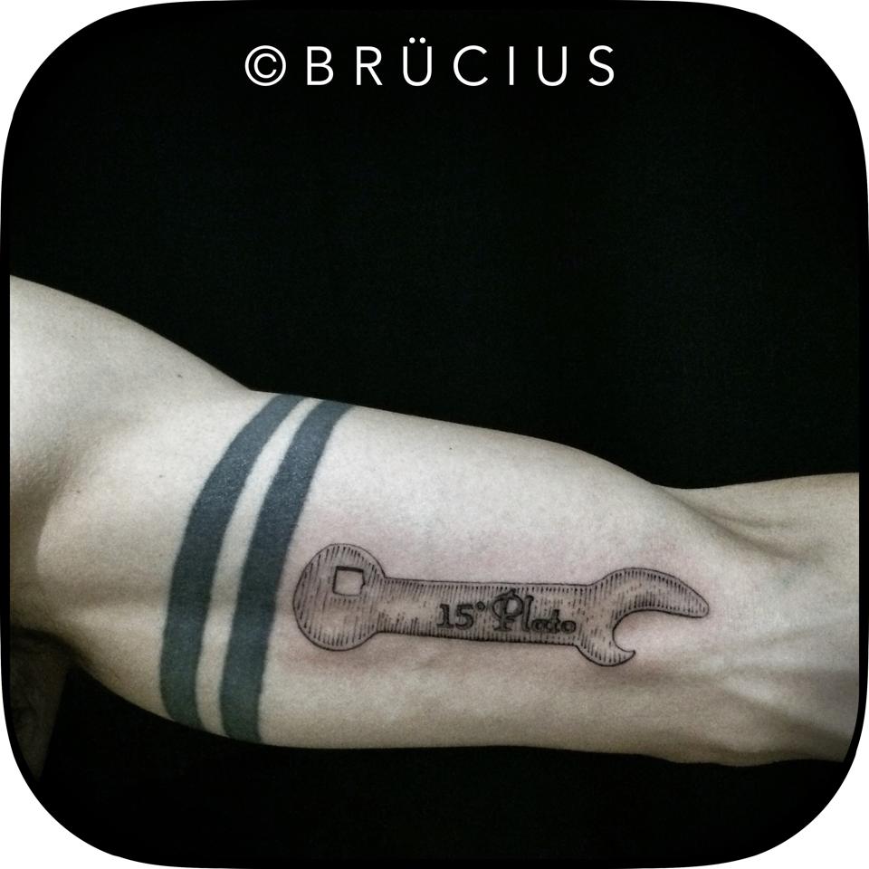Geometric Bottle Opener Tattoo On Left Bicep By Brucius