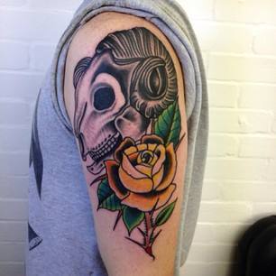 Goat Skull With Rose Tattoo On Left Half Sleeve By Sam Ricketts