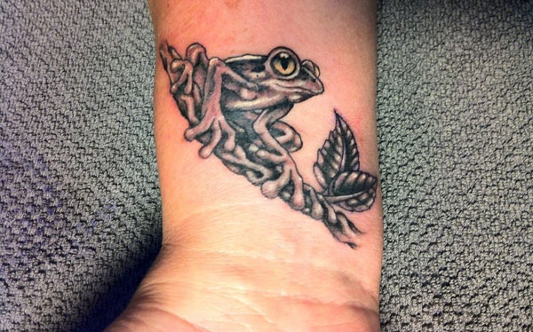 Grey And Black Frog Tattoo On Forearm