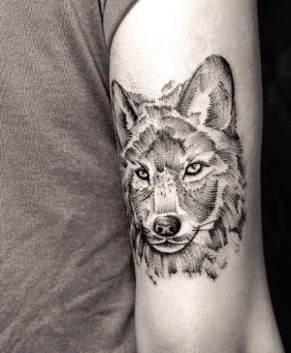 Grey Dotwork Wolf Tattoo On Bicep