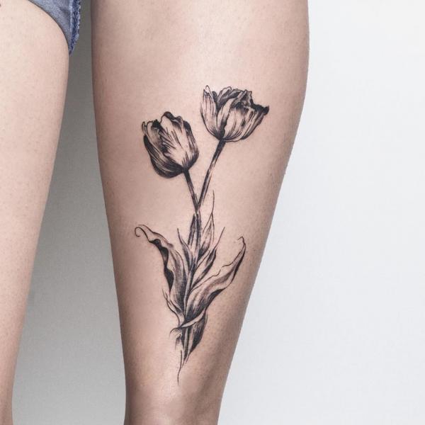 Grey Ink Tulip Tattoo On Leg