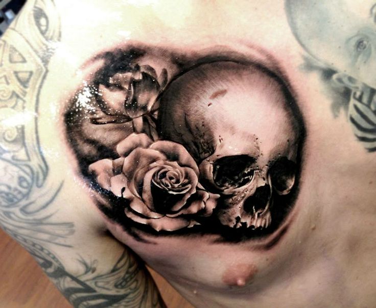 Grey Rose And 3D Skull Tattoo On Man Chest