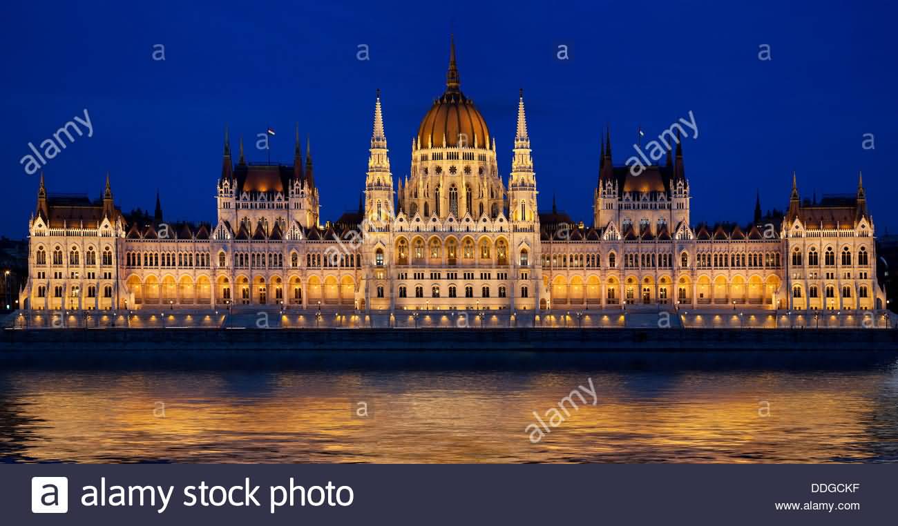 Hungarian Parliament Building And Danube River At Night