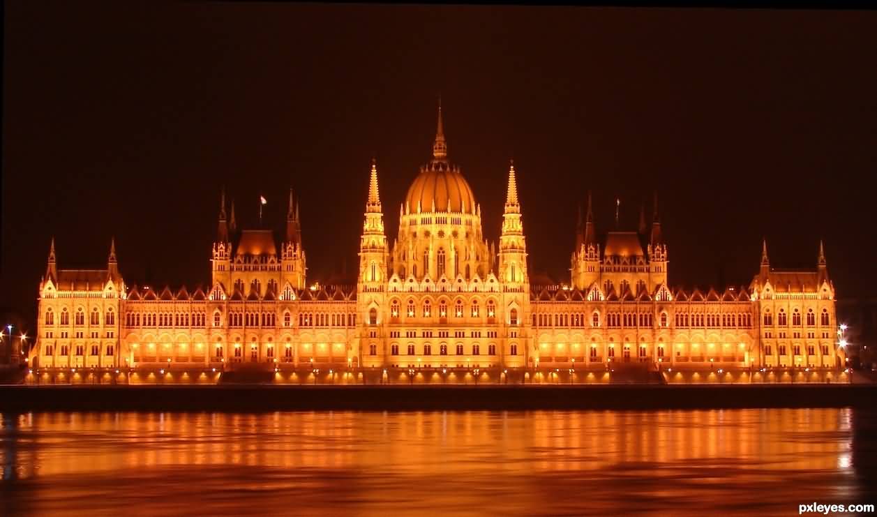 Hungarian Parliament Building Illuminated By Night In Budapest