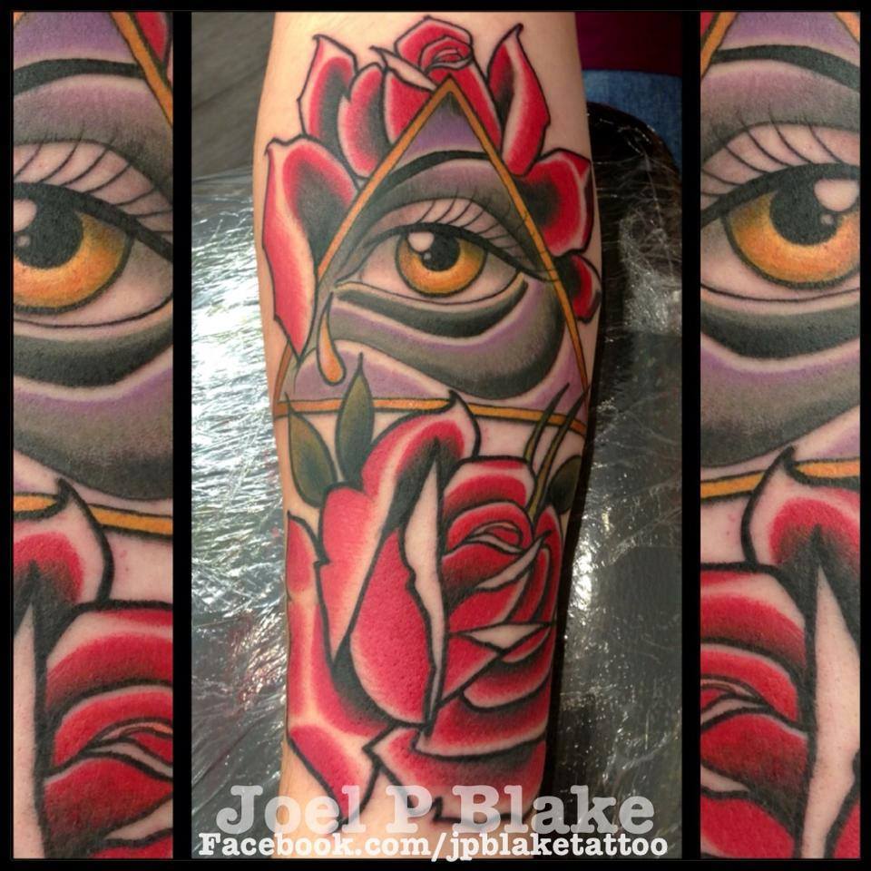 Illuminati Eye With Roses Tattoo On Forearm