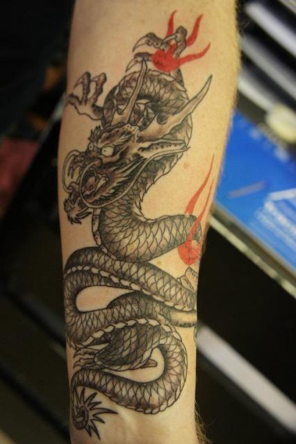 Latest Black Ink Dragon Tattoo On Forearm