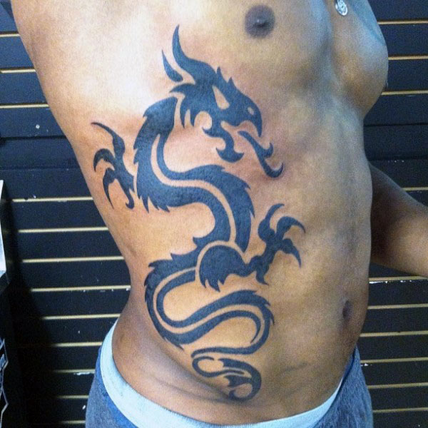 Latest Black Tribal Dragon Tattoo On Man Right Side Rib