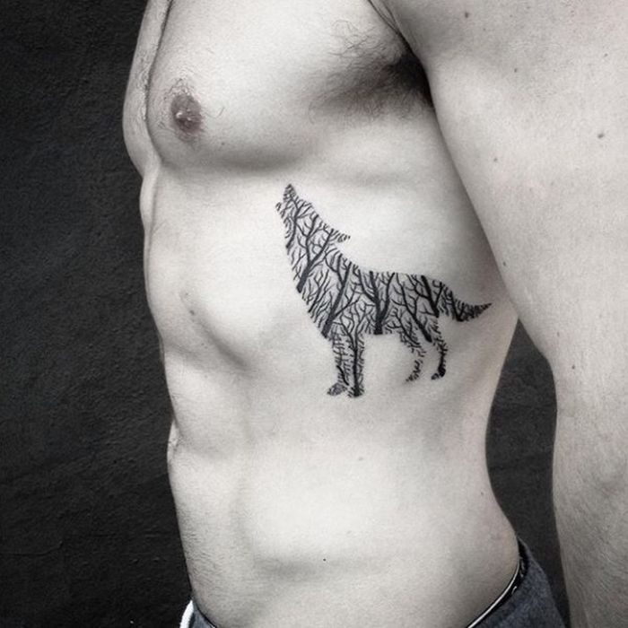 Man With Howling Wolf Tattoo On Rib Side