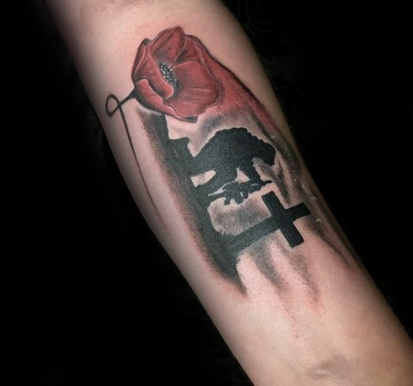 Memorial Cross And Poppy Flower Tattoo On Forearm