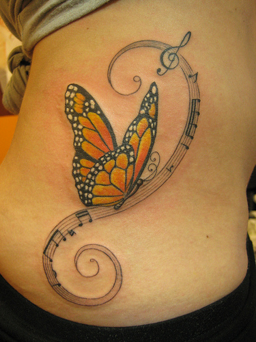 Music Notes And Butterfly Tattoo On Side Rib