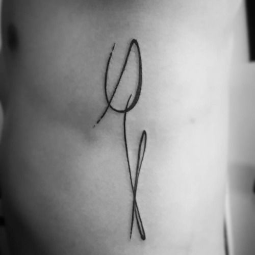 Outline Tulip Tattoo On Side Rib