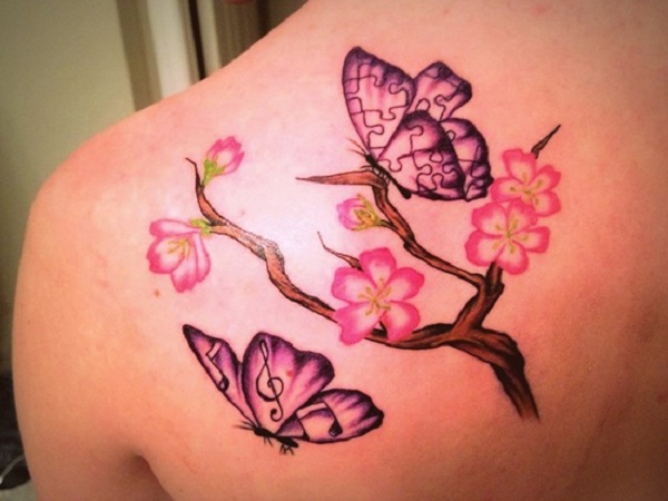 Pink Flowers And Butterfly Tattoos On Left Back Shoulder