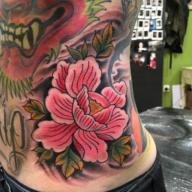 Pink Ink Traditional Peony Flower Tattoo On Left Side Rib