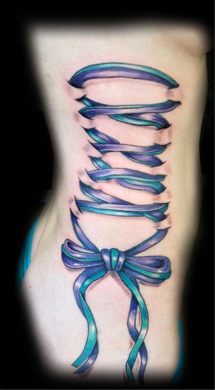 Purple And Green Ink Corset With Bow Tattoo On Right Side Rib