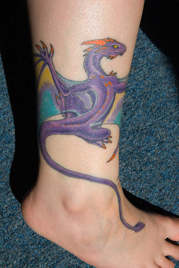 Purple Ink Dragon Tattoo On Right Leg