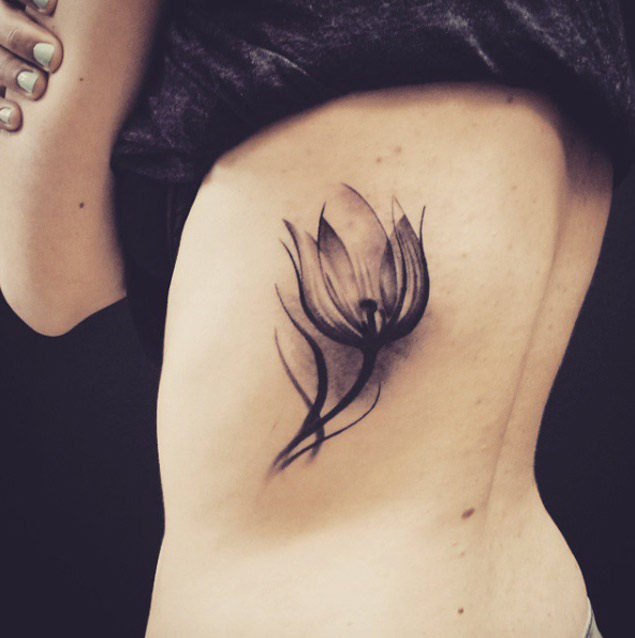 Realistic Black Tulip Tattoo On Side Rib