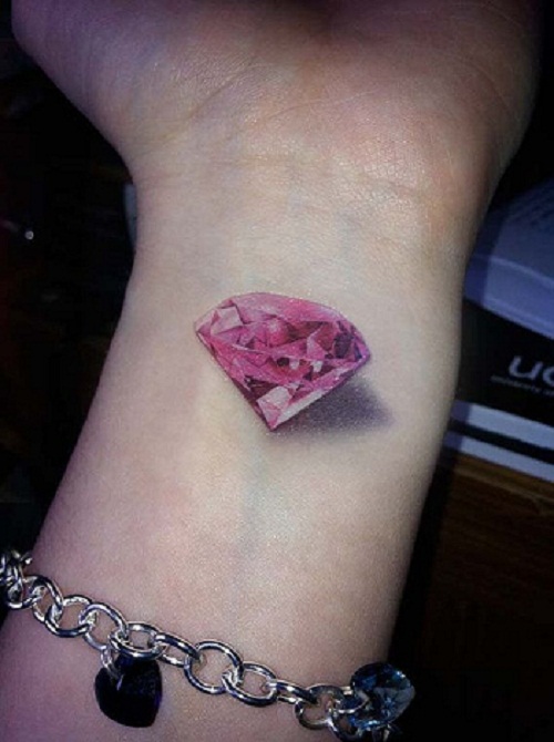 Realistic Pink Diamond Tattoo On Girl Left Wrist