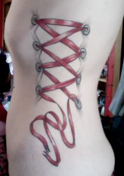 Red Ink Corset Tattoo On Left Side Rib