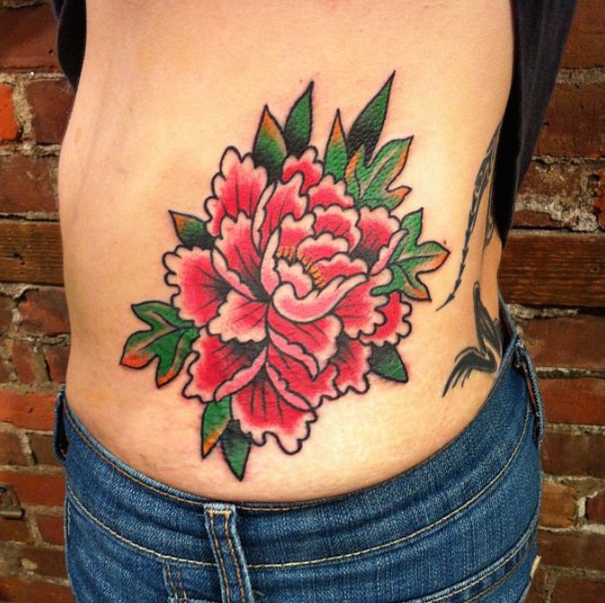 Red Ink Traditional Peony Flower Tattoo On Left Side Rib