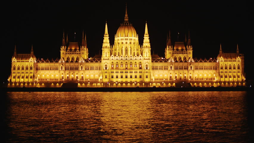 Reflection Of Night Lights Of Hungarian Parliament Building In Danube River Water