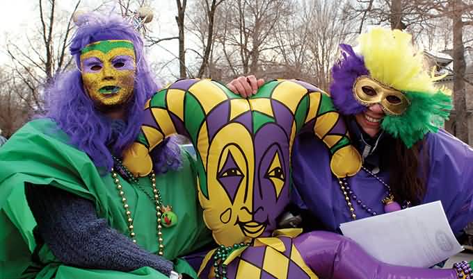 Revelers Wearing Clown Costumes During The Mardi Gras Parade