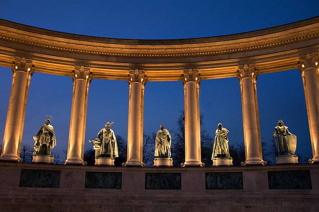 Sculptures At The Heroes Square At Dusk