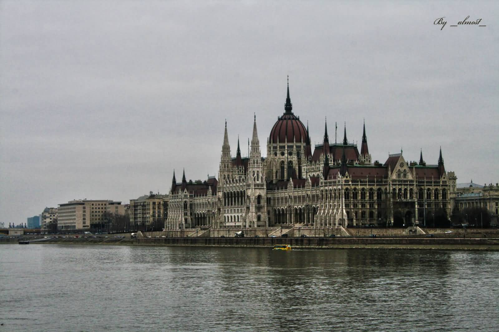 Side View Of Hungarian Parliament Building And Danube River
