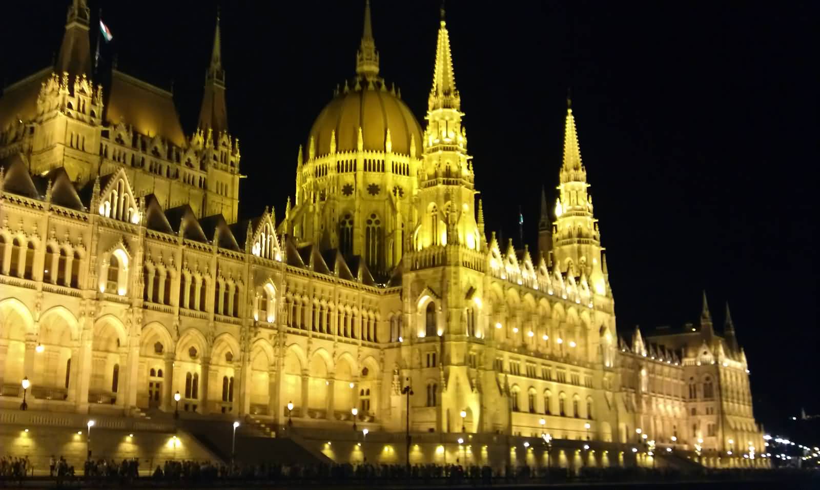 Side View Of The Hungarian Parliament Building With Night Lights