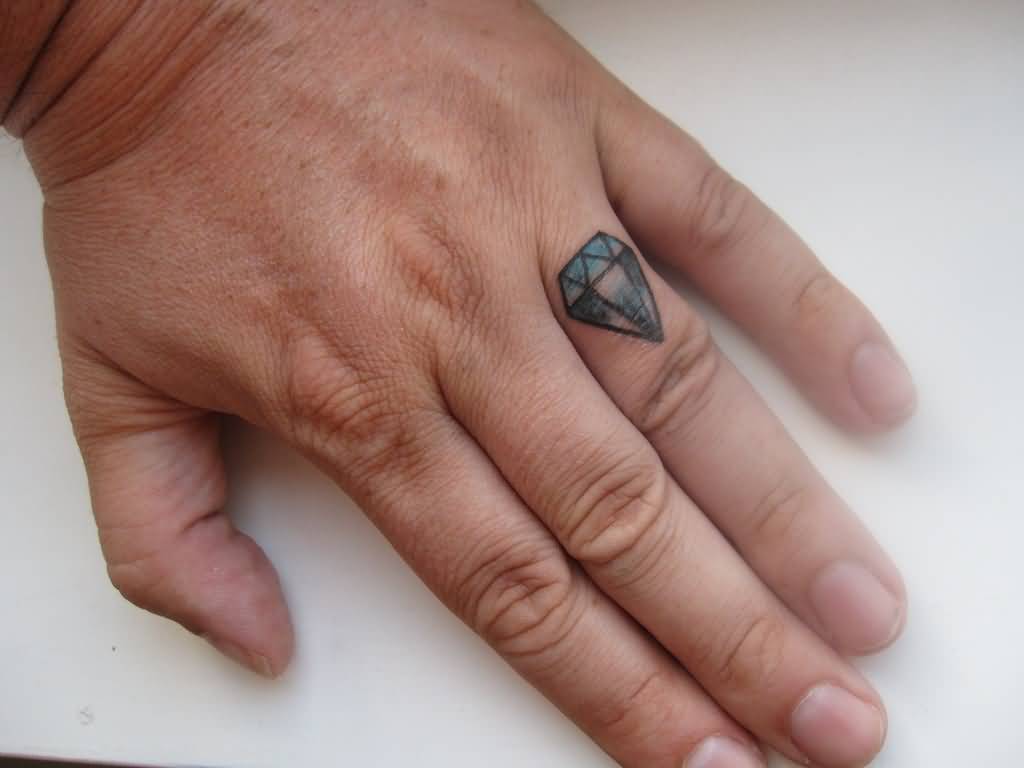 Small Blue Diamond Tattoo On Finger