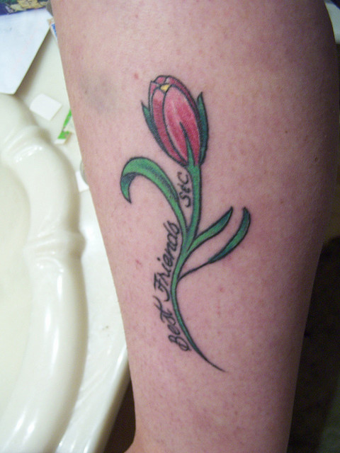 Small Tulip Tattoo On Side Leg