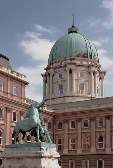 Statue Of Horseherd And Dome Of Buda Castle