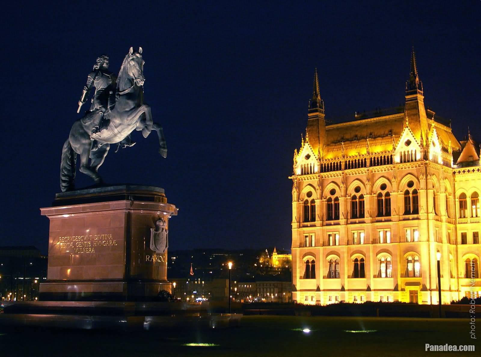 Statue Of The Hungarian Prince Francis II Rakoczi On The Back Side Of Hungarian Parliament Building At Night
