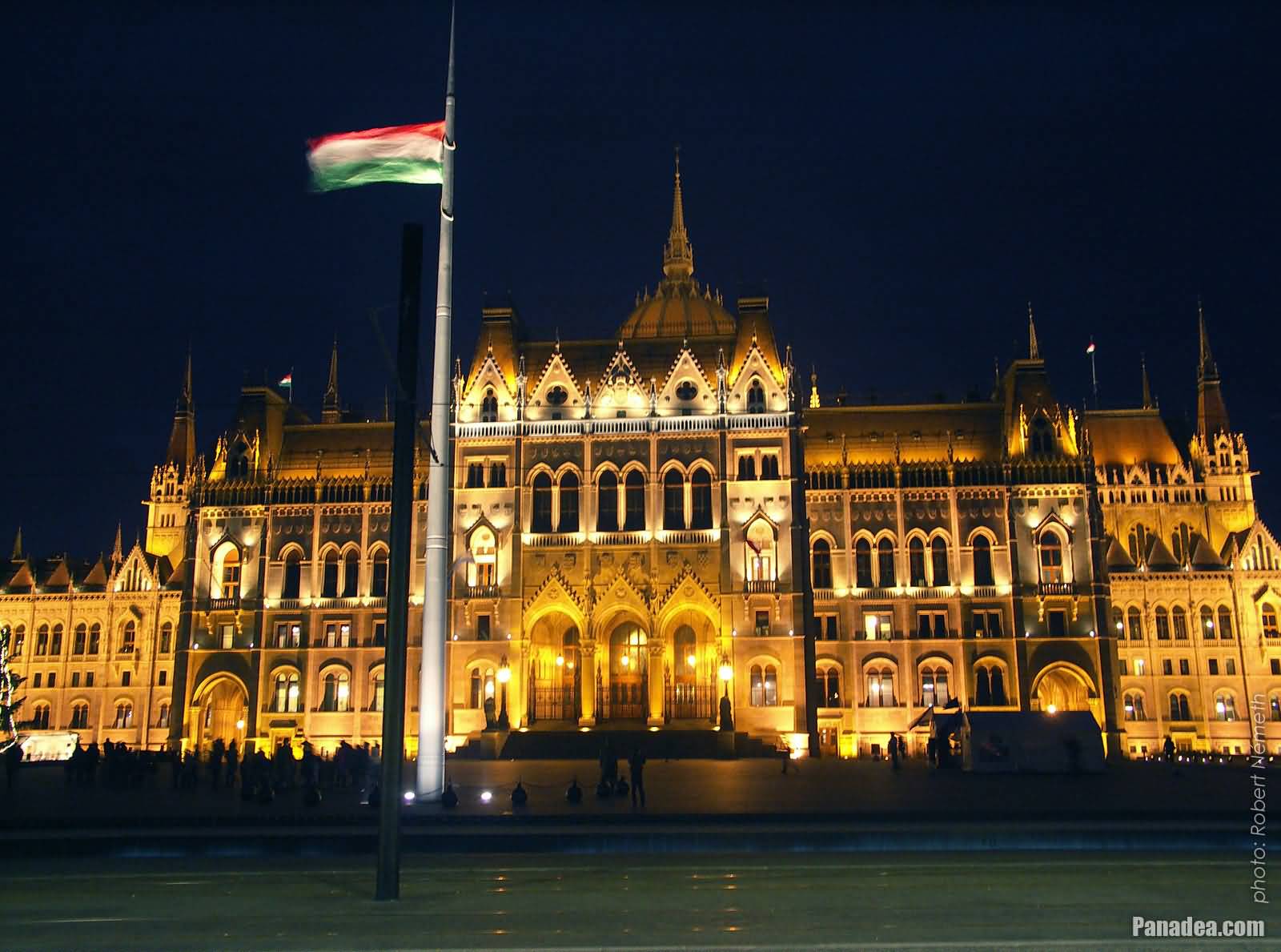 The Illuminated Hungry Flag And The Hungarian Parliament Building At Night