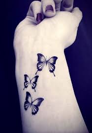 Three Butterfly Tattoos On Girl Right Wrist