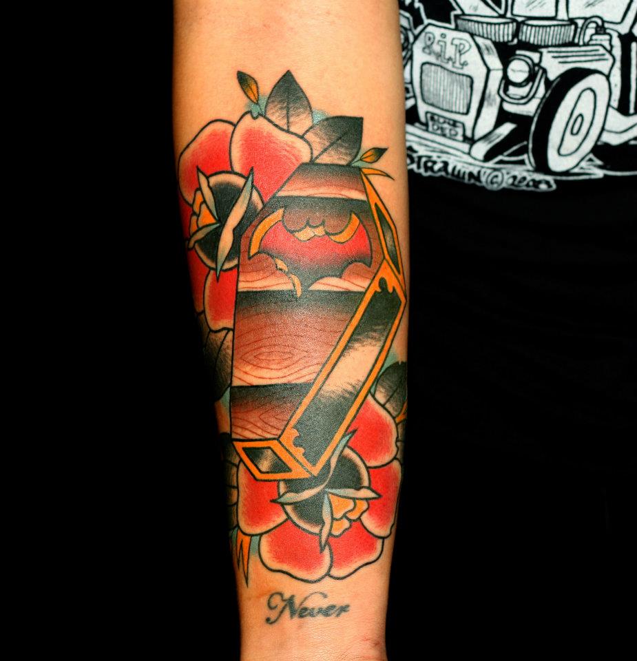 Traditional Coffin With Roses Tattoo On Left Forearm