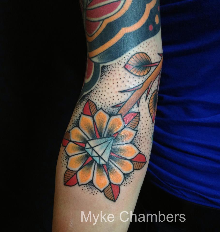 Traditional Diamond With Flower Tattoo On Forearm By Myke Chambers