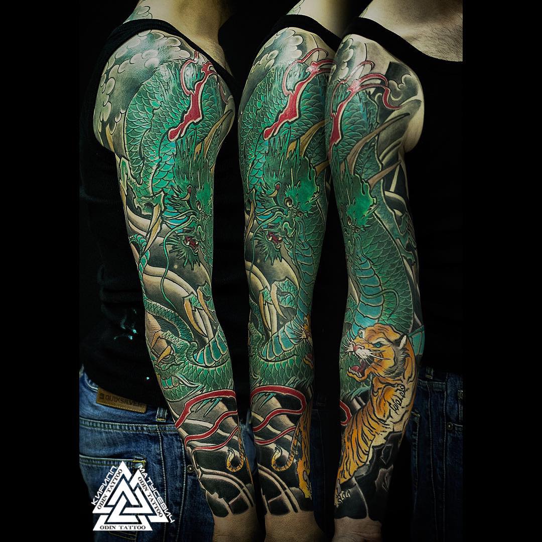 Traditional Dragon Tattoo On Man Right Full Sleeve