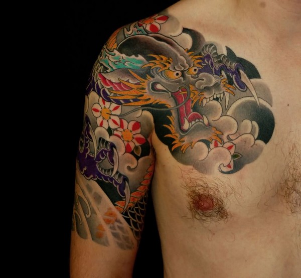 Traditional Dragon With Flowers Tattoo On Man Right Half Sleeve