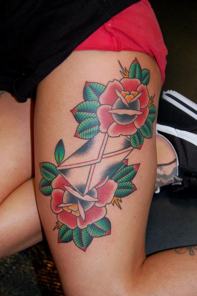 Traditional Envelope With Roses Tattoo On Left Thigh