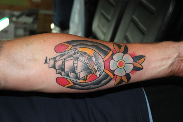 Traditional Horseshoe With Ship And Rose Tattoo On Forearm By Myke Chambers