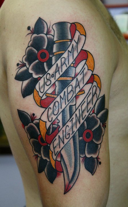 Traditional Knife With Flowers And Banner Tattoo On Half Sleeve By Myke Chambers