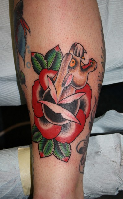 Traditional Panther Head In Rose Tattoo On Leg Calf