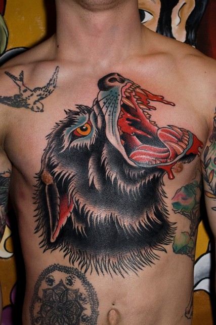 Traditional Roaring Wolf Head Tattoo On Man Chest