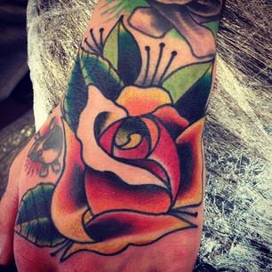 Traditional Rose Tattoo On Left Hand By Sam Ricketts